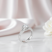 Silver ring with a diamond on a soft pink background