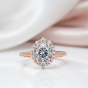 Rose gold diamond ring on a soft white background