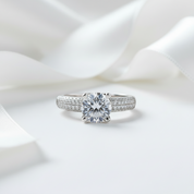 Diamond ring on a white satin background