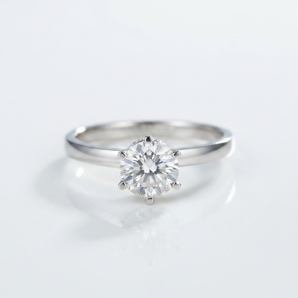 Silver ring with a diamond on a light gray background