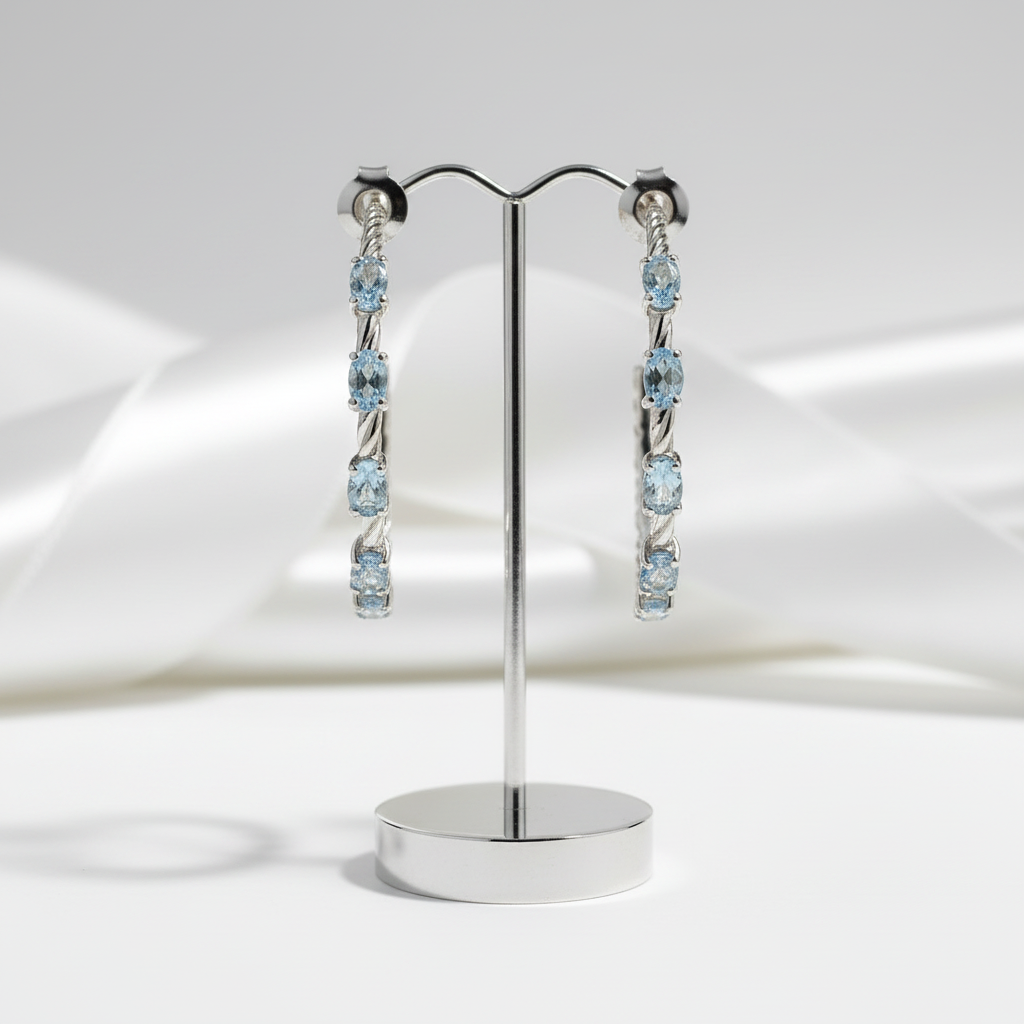 2.94 Ctw Oval Sky Blue Topaz Hoop Earrings-Black Diamonds New York