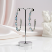2.94 Ctw Oval Sky Blue Topaz Hoop Earrings-Black Diamonds New York