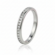 A polished silver-tone eternity band ring featuring a channel-set row of clear round-cut stones on a seamless white background with a soft reflection.