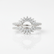 A pair of silver-toned wedding bands featuring a sunburst design set with marquise-cut and round diamonds, displayed on a clean white reflective surface.