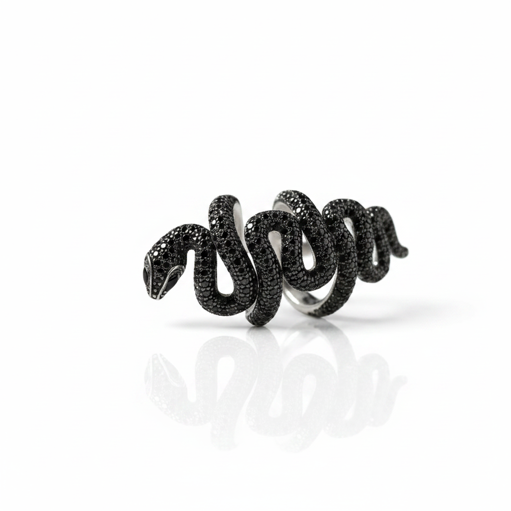 A black snake ring with a textured, pave-set finish, shown on a clean white background with a soft reflection below.