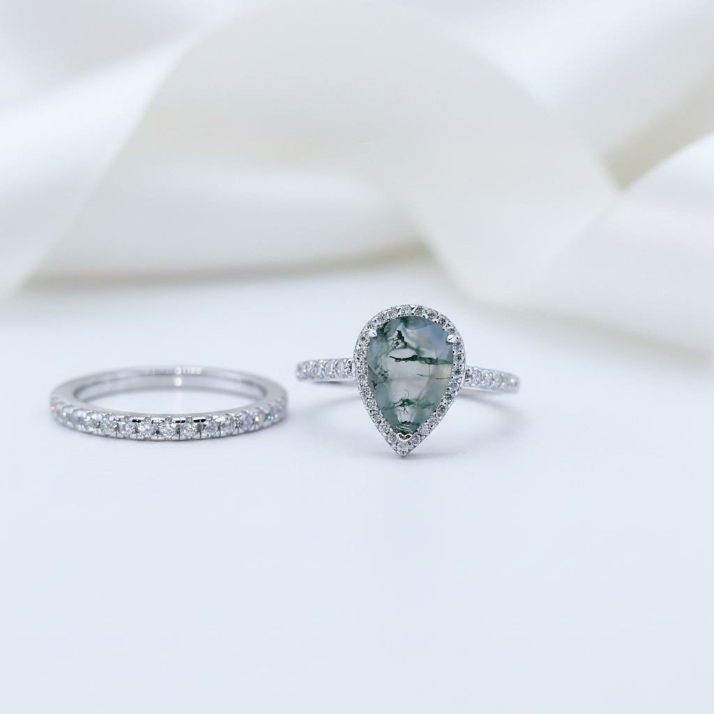 Two rings with gemstones on a white background
