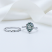 Two rings with gemstones on a white background