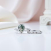 Two silver rings with gemstones on a soft white background
