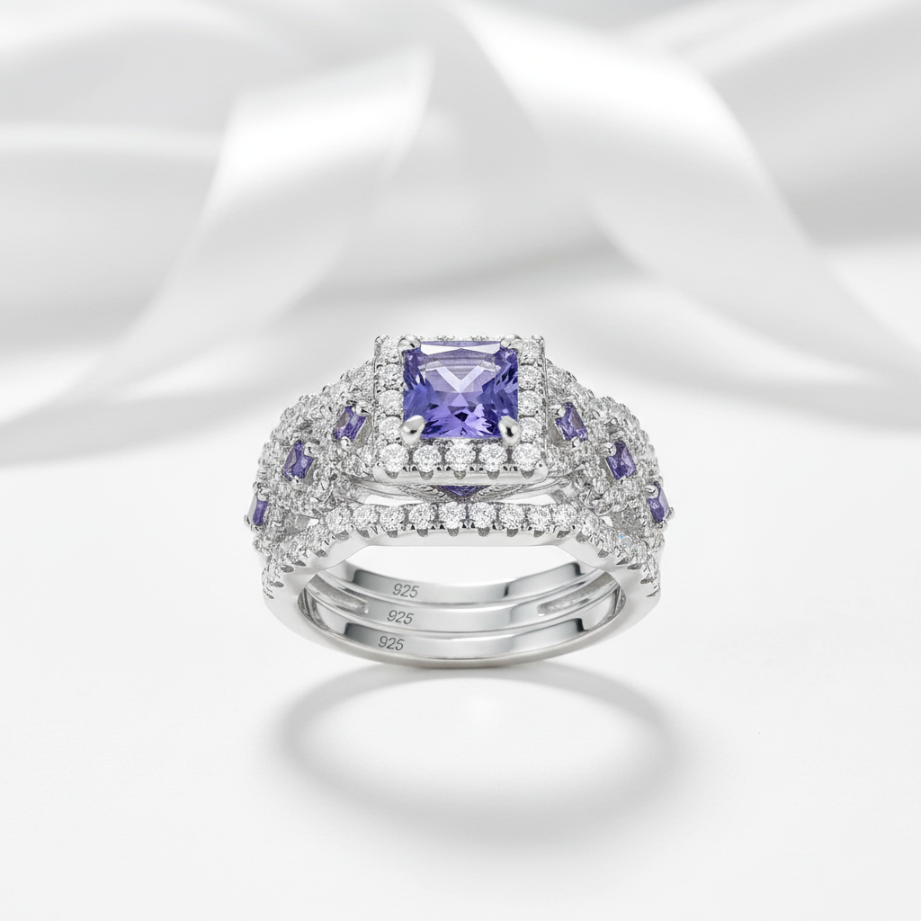 Elegant ring with a purple gemstone on a white background