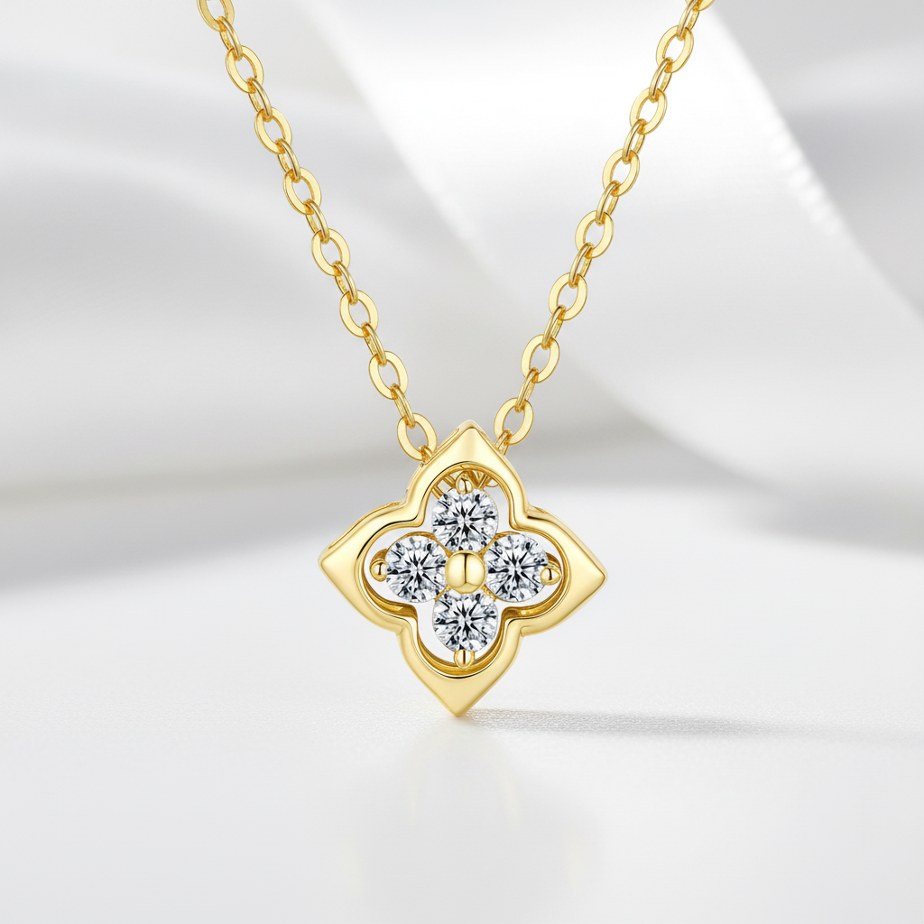 Gold necklace with a diamond pendant on a light background