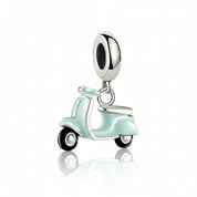 A silver-tone charm shaped like a retro scooter in mint green enamel, shown on a clean white background with a soft reflection below.