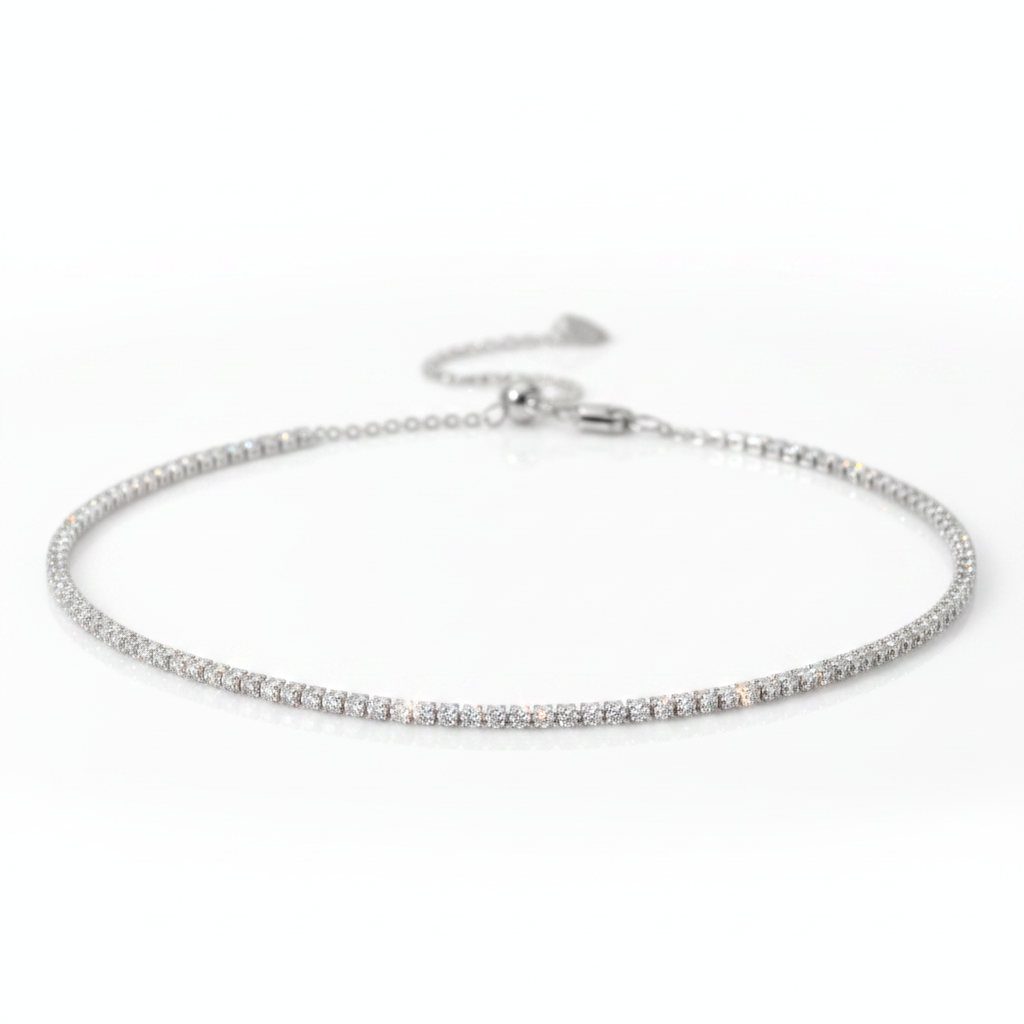 Silver bracelet with a heart-shaped clasp on a white background