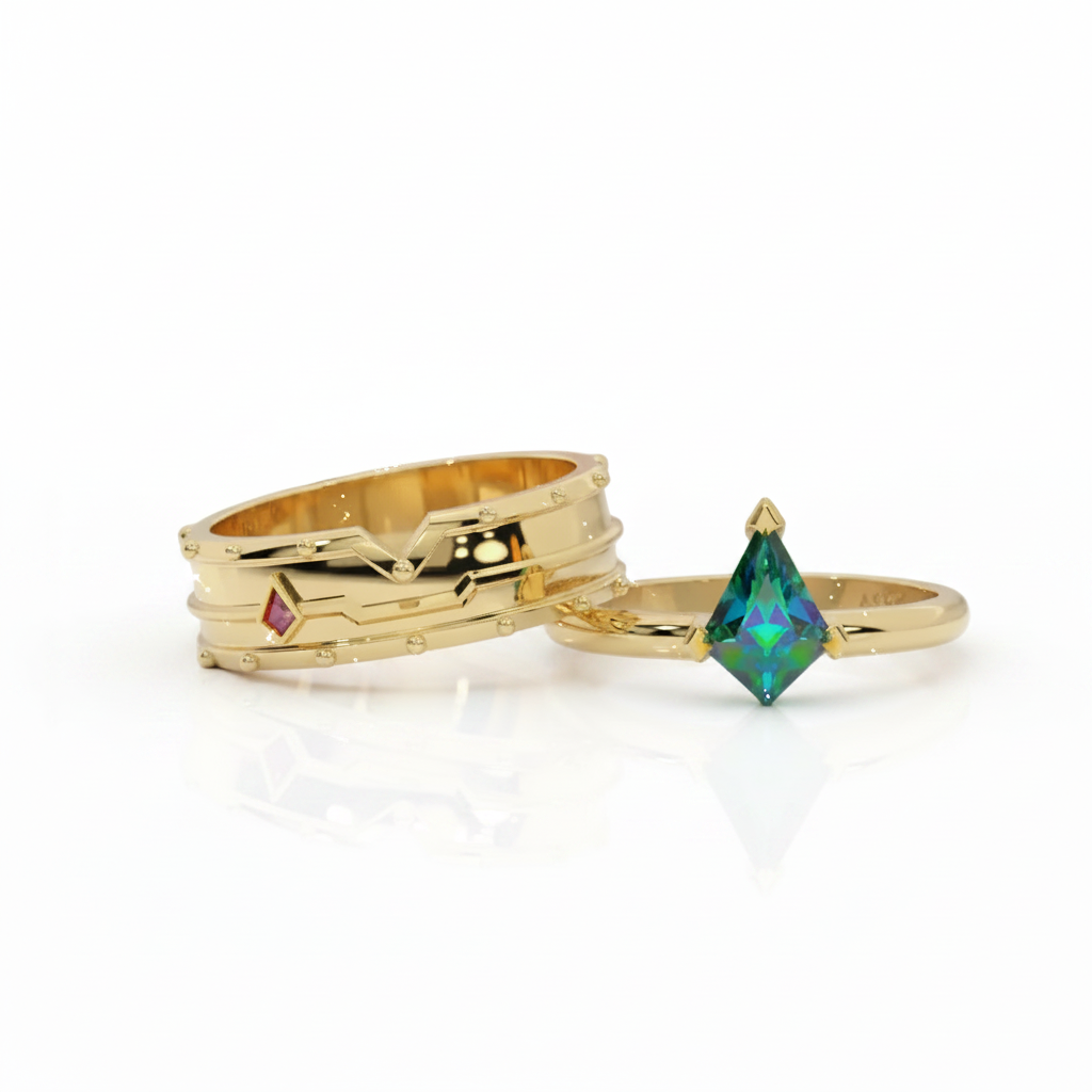 Three gold rings displayed on a reflective white surface. One ring features a marquise-cut iridescent green gemstone, while the other two are textured gold bands, one with a tiny pink accent.