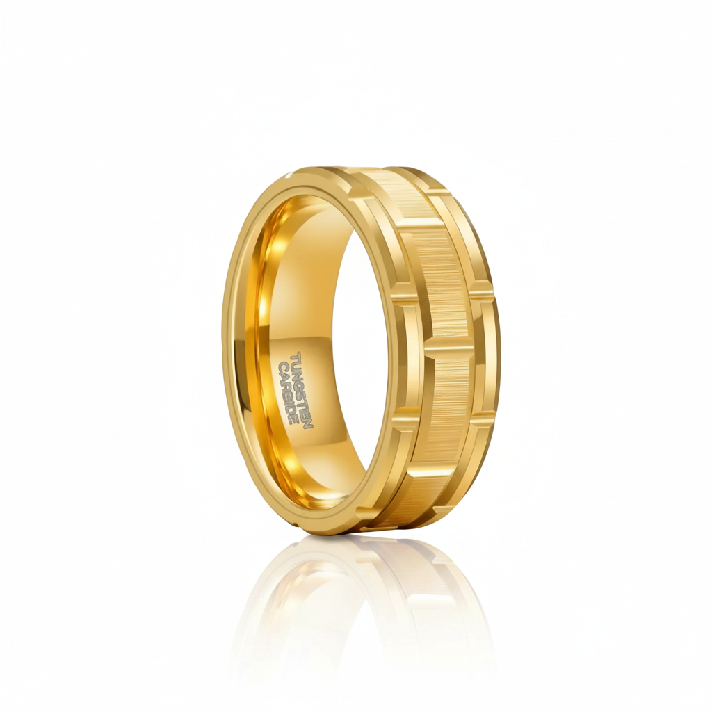A gold-colored metal ring with a textured, geometric ridged outer band and a polished inner band, shown on a clean white background with a soft reflection below.