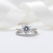 Two diamond rings on a white background