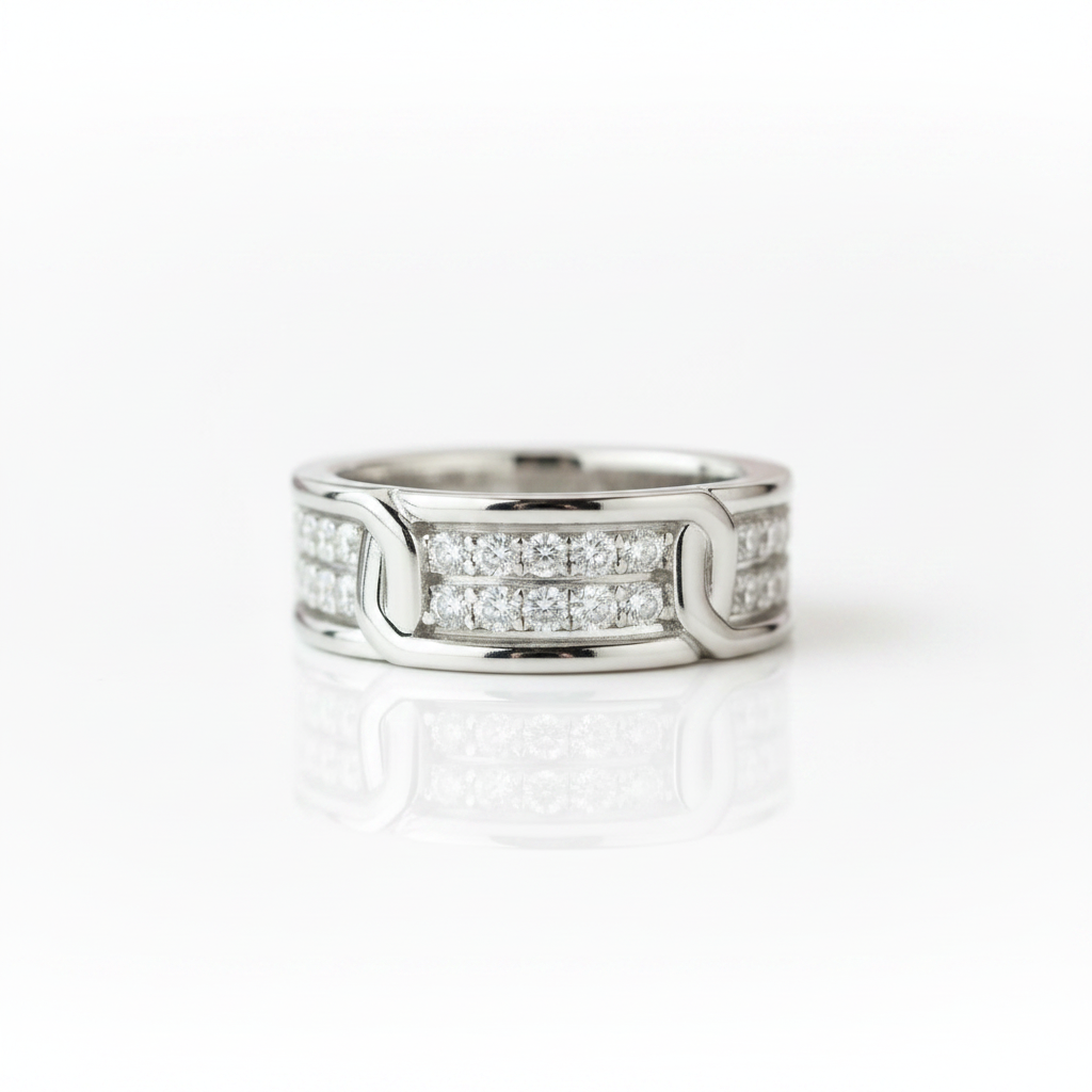 A silver-toned diamond ring with a modern interlocking design, featuring rows of clear pavé diamonds on a clean white background with a soft reflection.
