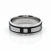 A titanium ring band with a black inlay, featuring rectangular bezel-set clear stones on the outer band and engraved 'TITANIUM' inside the polished band, shown on a white reflective background.