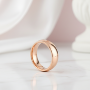 Rose gold ring on a white background