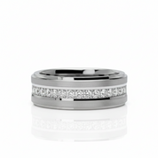 A silver-toned metal band ring featuring a channel-set row of clear diamonds on the front, photographed on a clean white background with a soft reflection below.