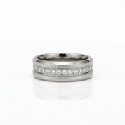 A gold ring featuring a large white pearl set within an openwork filigree design, shown against a plain light gray background.