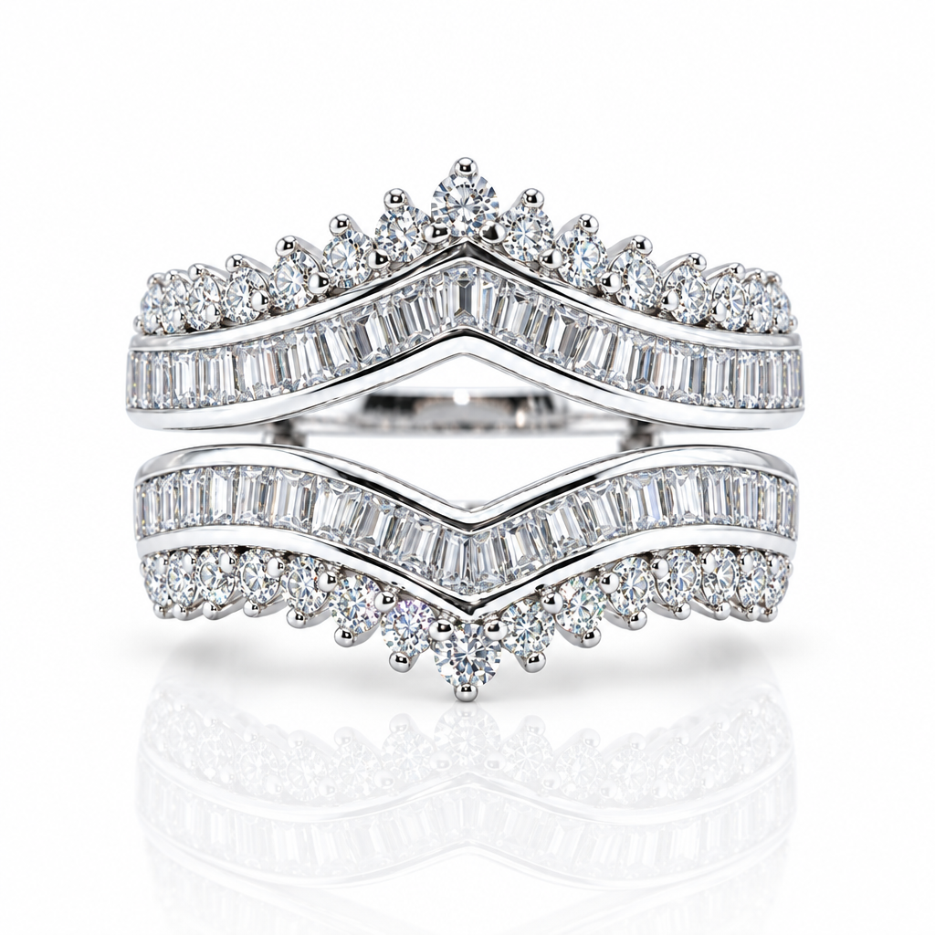 A double ring set in bright white metal, featuring rows of baguette and round brilliant-cut diamonds. The top ring has a crown-like diamond pattern, and the bottom ring mirrors it with a pointed diamond center, set against a clean white background with a soft reflection.