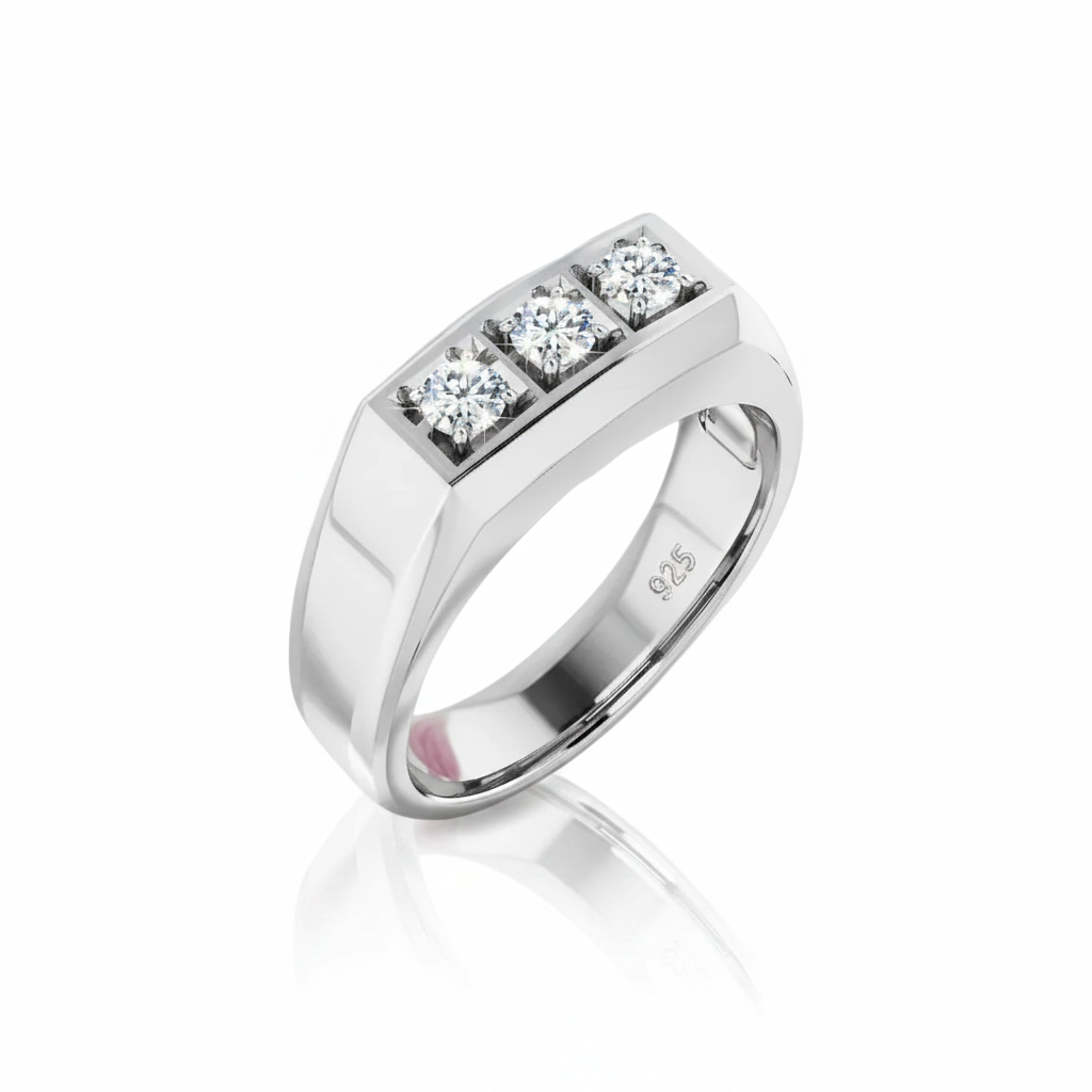 A silver-toned men's band ring featuring a rectangular bezel set with three round brilliant-cut diamonds, shown on a clean white background with a soft reflection.
