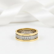 Two gold rings with diamond accents on a white background