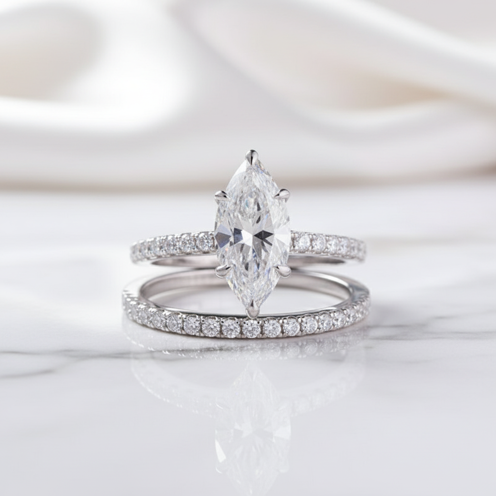 Two diamond rings on a soft white background