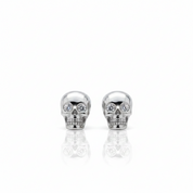 A pair of silver skull stud earrings with clear crystal eyes, displayed on a clean white background with a soft reflection below.