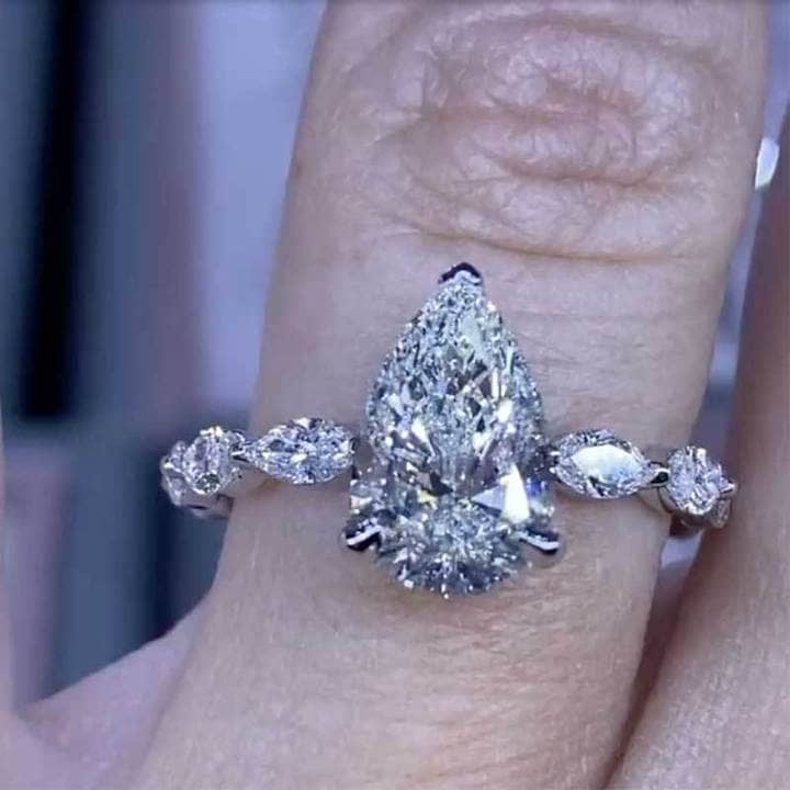 3.0 Carat Pear Cut Engagement Ring With Marquise Cut Side Stone