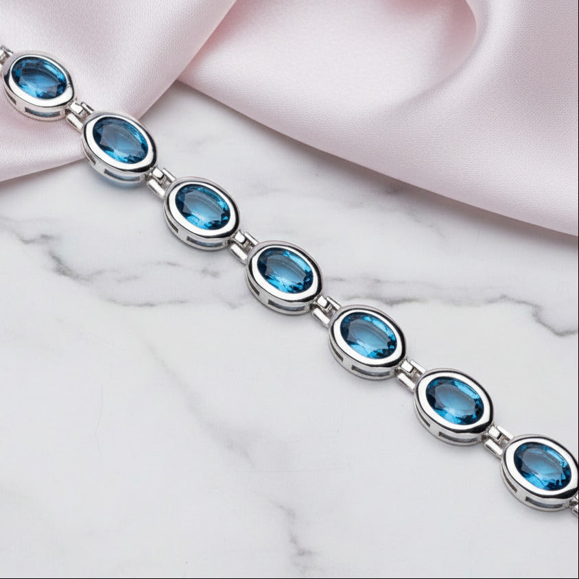 Oval London Blue Topaz Gemstone Bracelet-Black Diamonds New York