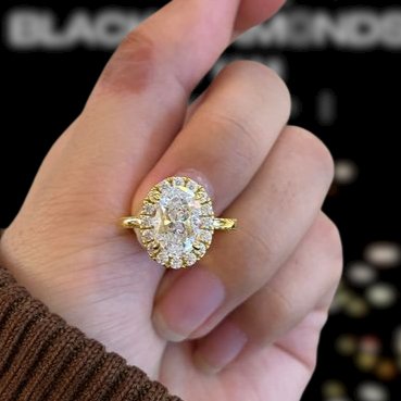 Elegant Yellow Gold Oval Cut Halo Engagement Ring - Black Diamonds New York