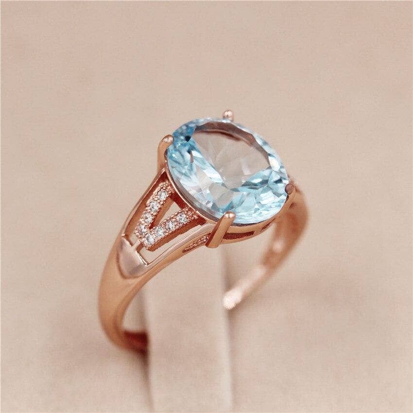 Light Blue Topaz Zircon Ring with CZ Stone