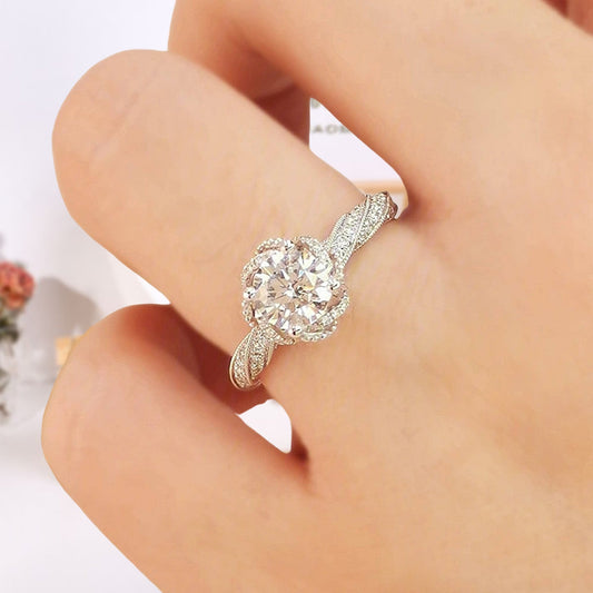 Round Cut 18k Moissanite Halo Twist Engagement Ring - Black Diamonds New York